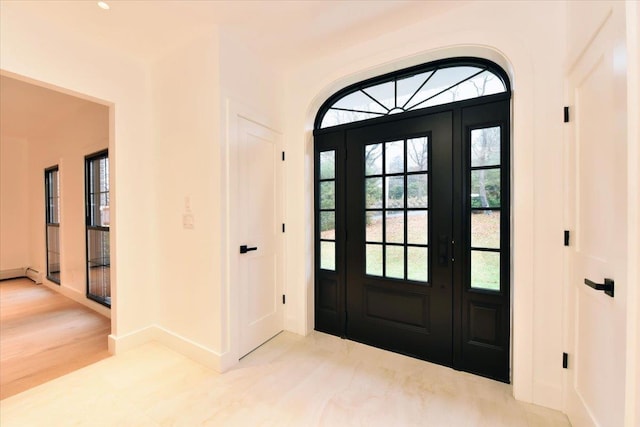 foyer entrance with light wood-type flooring