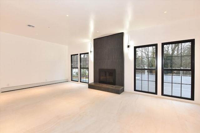 unfurnished living room with a fireplace and a baseboard radiator