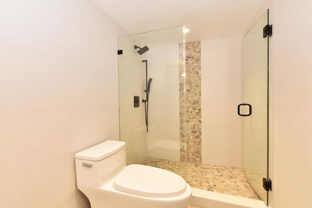 bathroom with toilet and an enclosed shower