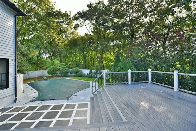 view of swimming pool featuring a deck