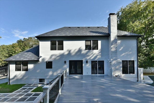 rear view of property featuring french doors