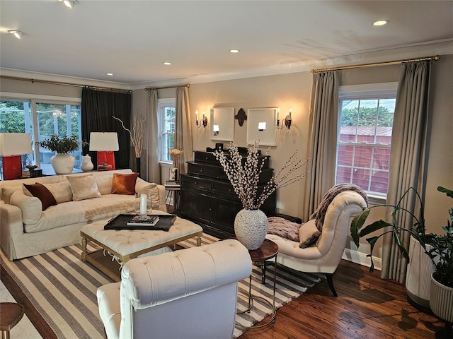 living room featuring dark wood-type flooring and ornamental molding