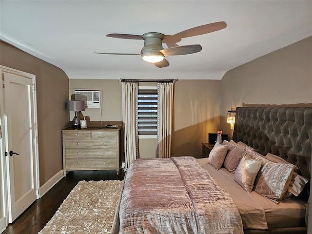 bedroom with a wall unit AC, ceiling fan, and dark hardwood / wood-style floors