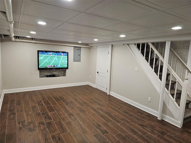 basement with electric panel and dark wood-type flooring