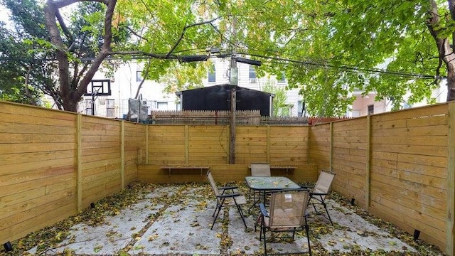 view of patio featuring outdoor dining space and a fenced backyard