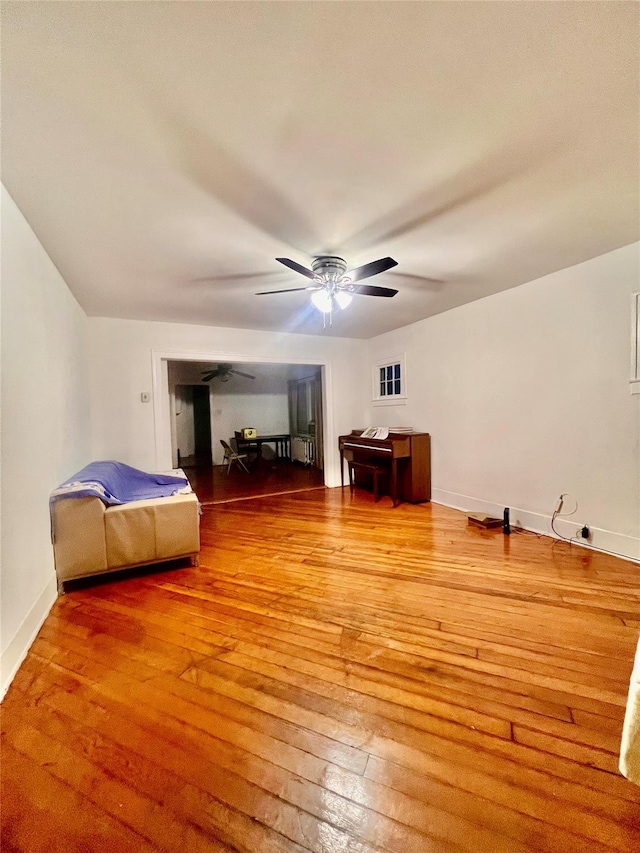 bedroom featuring ceiling fan and wood-type flooring