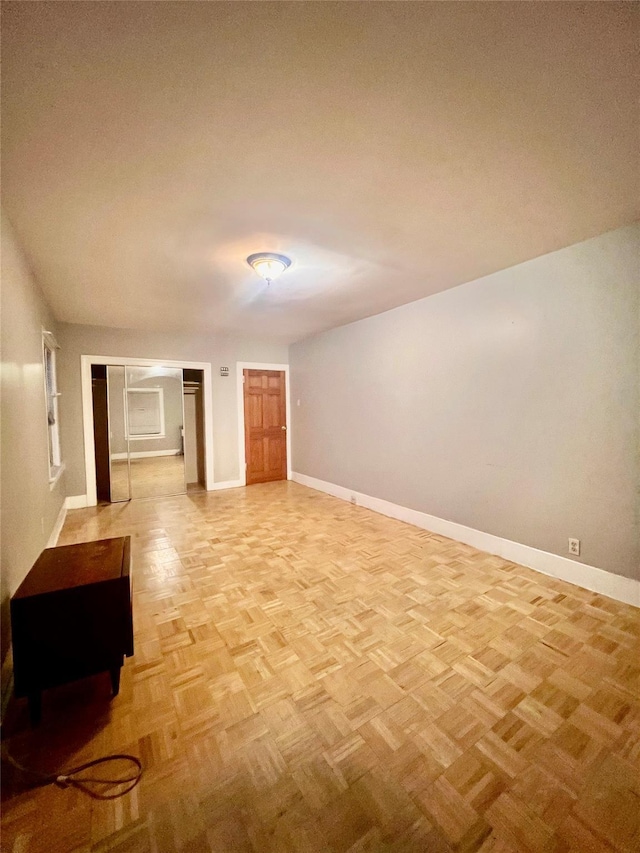 spare room featuring light parquet flooring