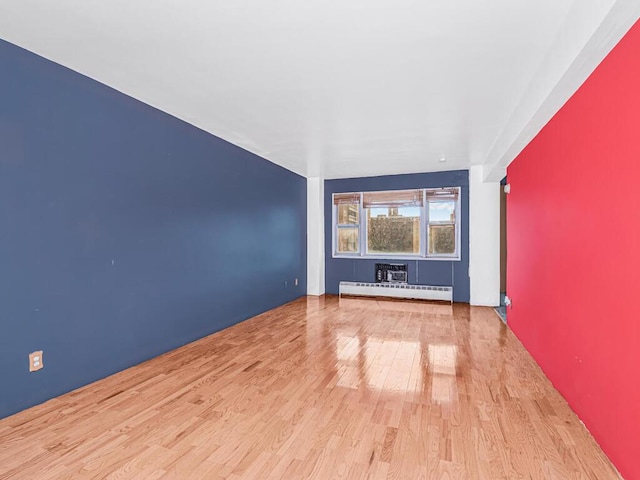 interior space with light hardwood / wood-style floors and a baseboard radiator