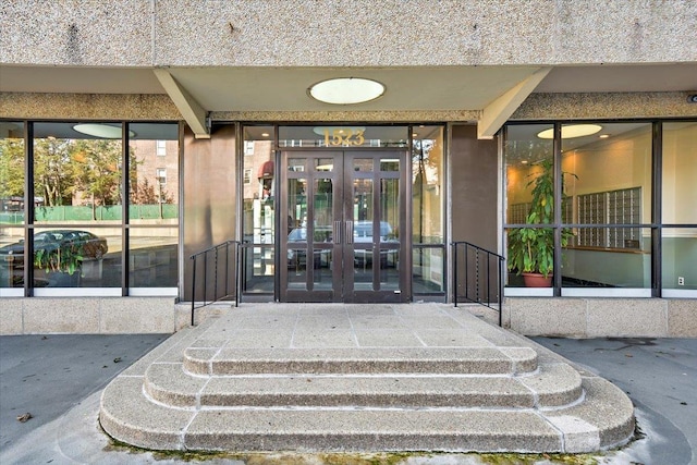 property entrance featuring french doors