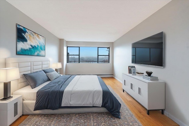 bedroom with light wood-type flooring