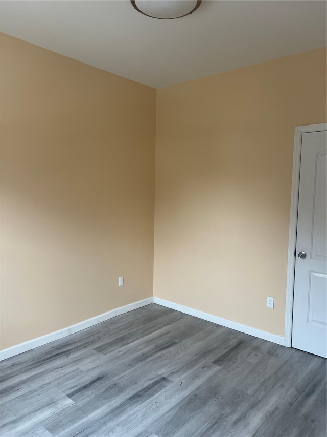 88 Taft Ave, Staten Island, NY 10301 - spare room featuring dark wood-style floors and baseboards