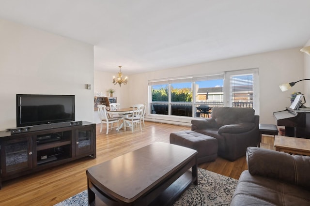 living room featuring hardwood / wood-style floors and an inviting chandelier