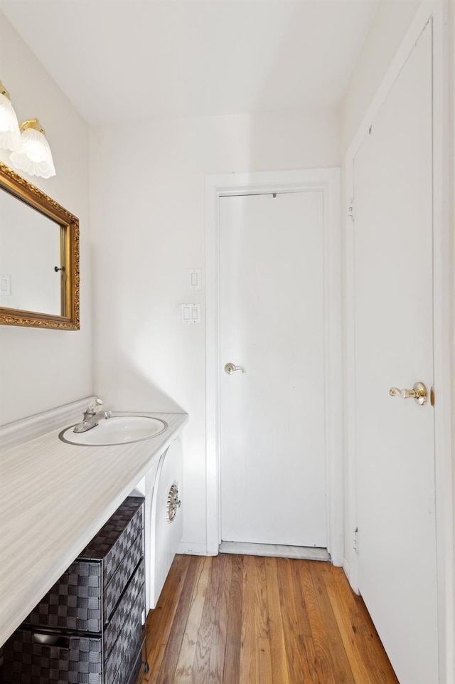 bathroom featuring hardwood / wood-style floors and sink