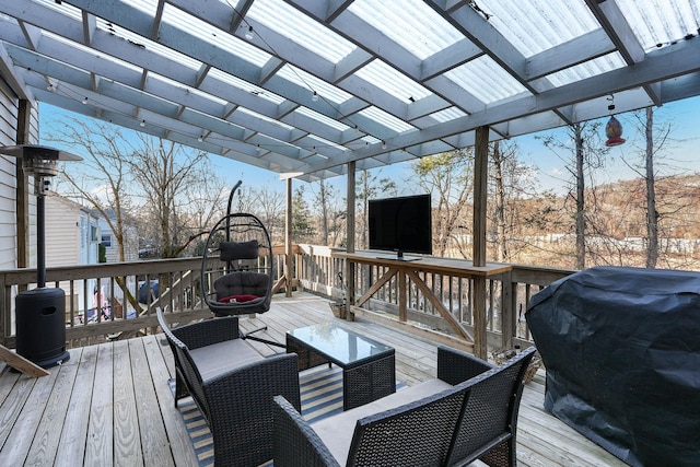 deck featuring a pergola and grilling area