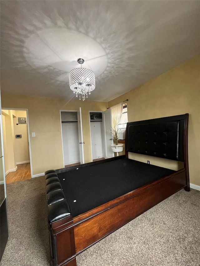 game room with carpet, an inviting chandelier, and pool table