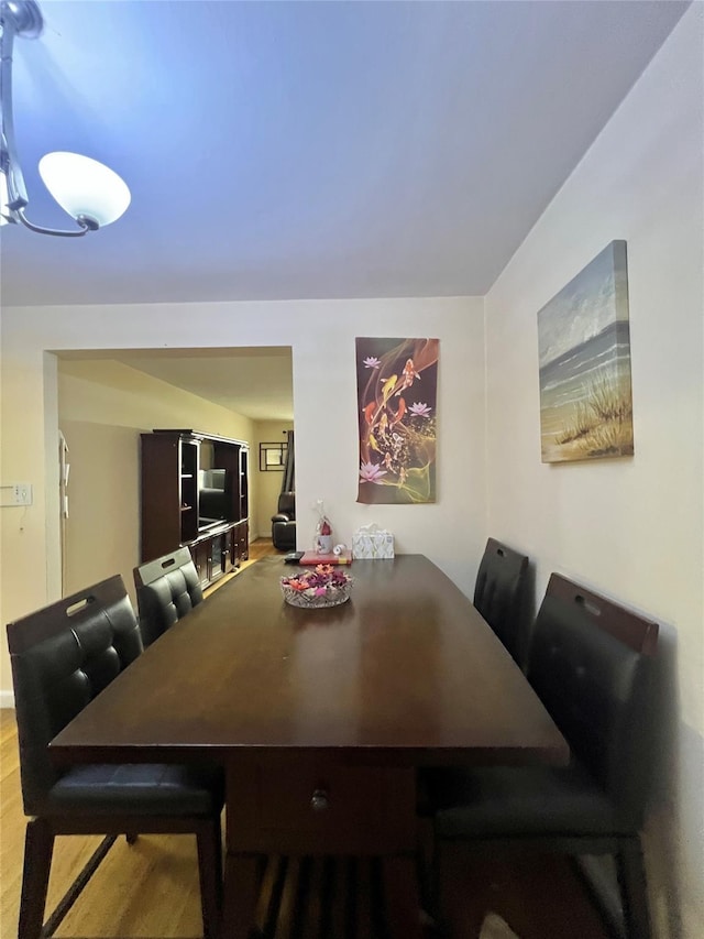 dining space featuring hardwood / wood-style floors