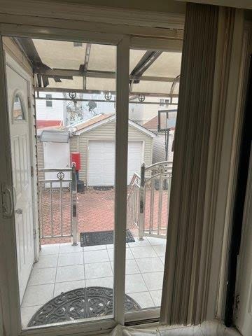 doorway featuring tile patterned flooring