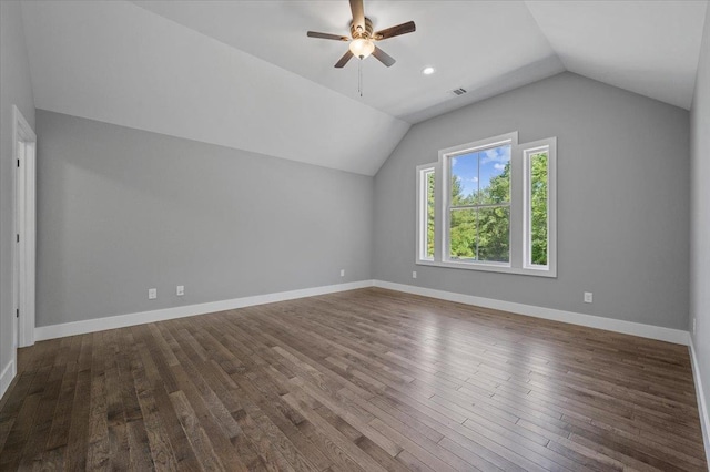 bonus room with ceiling fan, dark hardwood / wood-style flooring, and vaulted ceiling