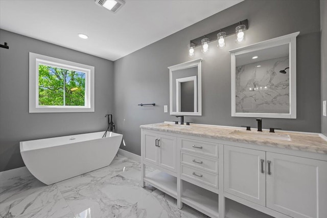 bathroom featuring a bathing tub and vanity