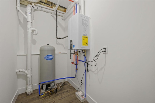 utility room with tankless water heater