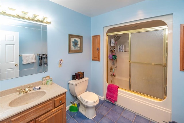 full bathroom featuring toilet, tile patterned flooring, vanity, and combined bath / shower with glass door