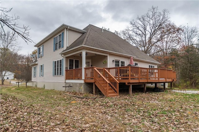 rear view of house with a wooden deck