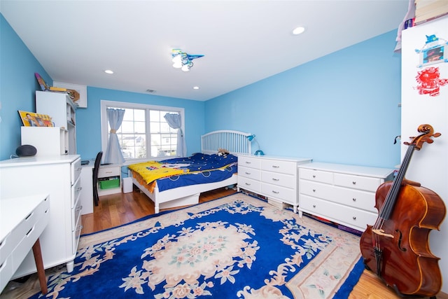 bedroom with light hardwood / wood-style floors