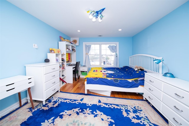 bedroom with light hardwood / wood-style floors