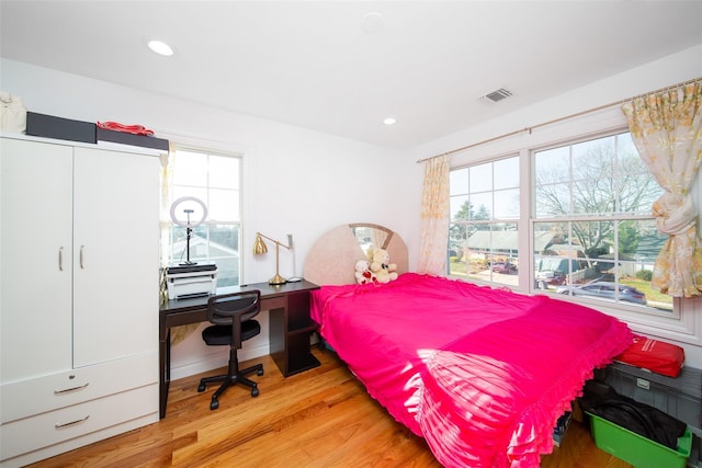 bedroom featuring light wood-type flooring