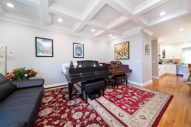 interior space with beam ceiling, ornamental molding, coffered ceiling, and light wood-type flooring