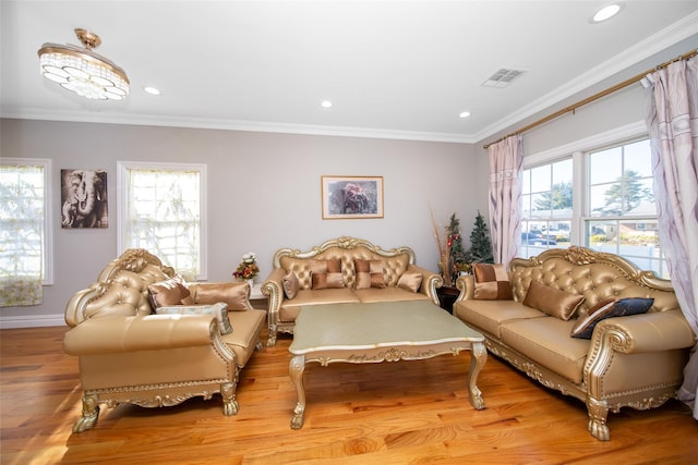 living room featuring light wood-type flooring and crown molding