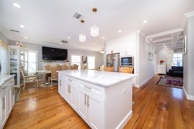 kitchen featuring crown molding, light hardwood / wood-style flooring, white cabinets, and appliances with stainless steel finishes