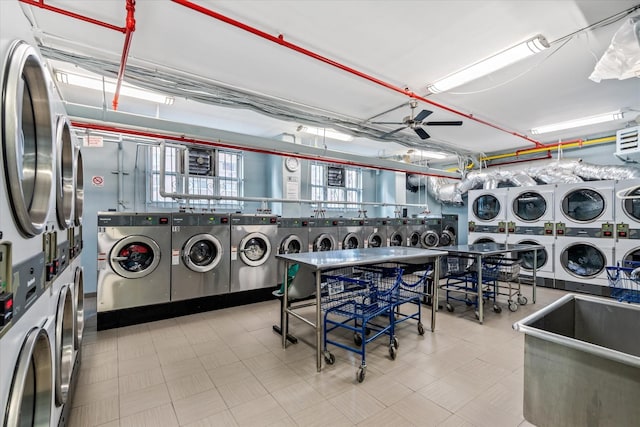 clothes washing area with washing machine and dryer, stacked washing maching and dryer, and ceiling fan