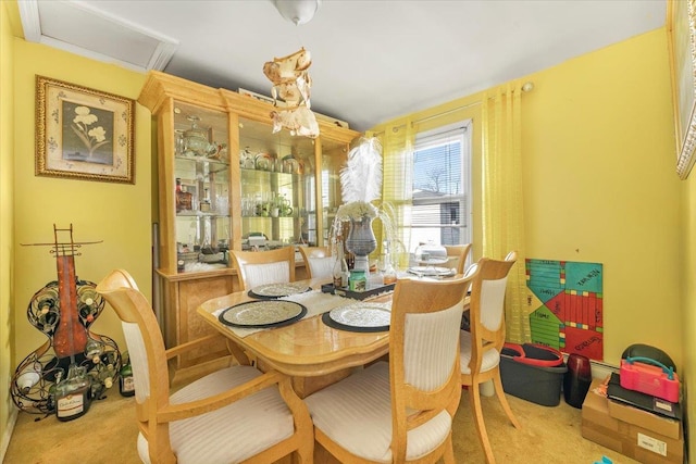 dining area with light colored carpet