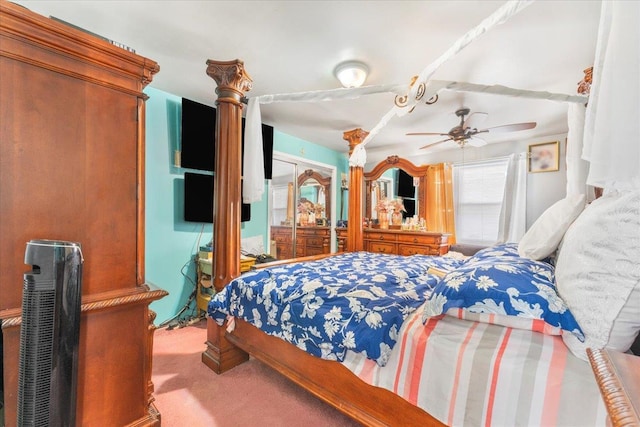 bedroom featuring light colored carpet and ceiling fan