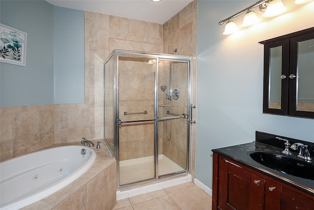 bathroom with tile patterned flooring, vanity, and independent shower and bath