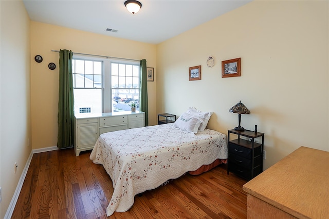 bedroom featuring dark hardwood / wood-style floors