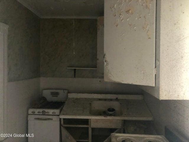 kitchen with white gas range