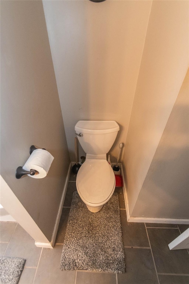 bathroom with tile patterned flooring and toilet