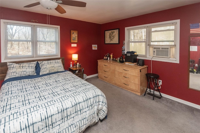 carpeted bedroom with multiple windows, ceiling fan, and cooling unit