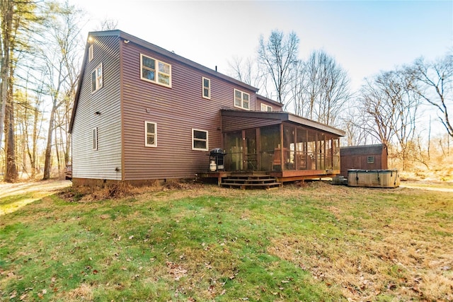 rear view of property featuring a lawn, a pool side deck, and a sunroom