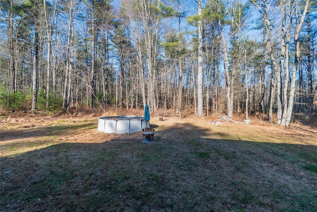 view of yard featuring a covered pool