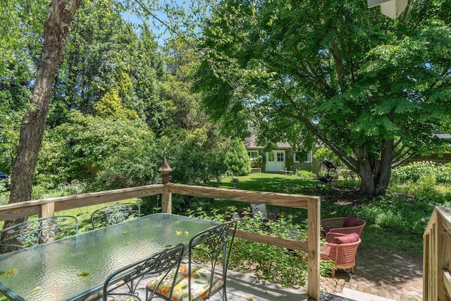 deck featuring a lawn