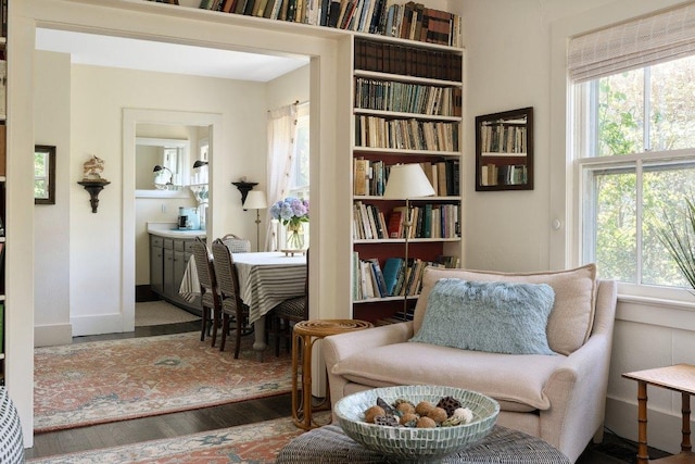 living area with hardwood / wood-style flooring and a wealth of natural light