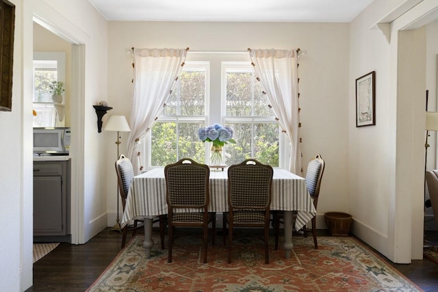 dining area featuring dark hardwood / wood-style floors