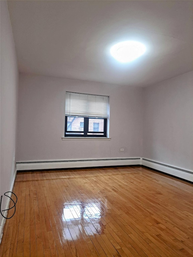 spare room featuring light wood-type flooring