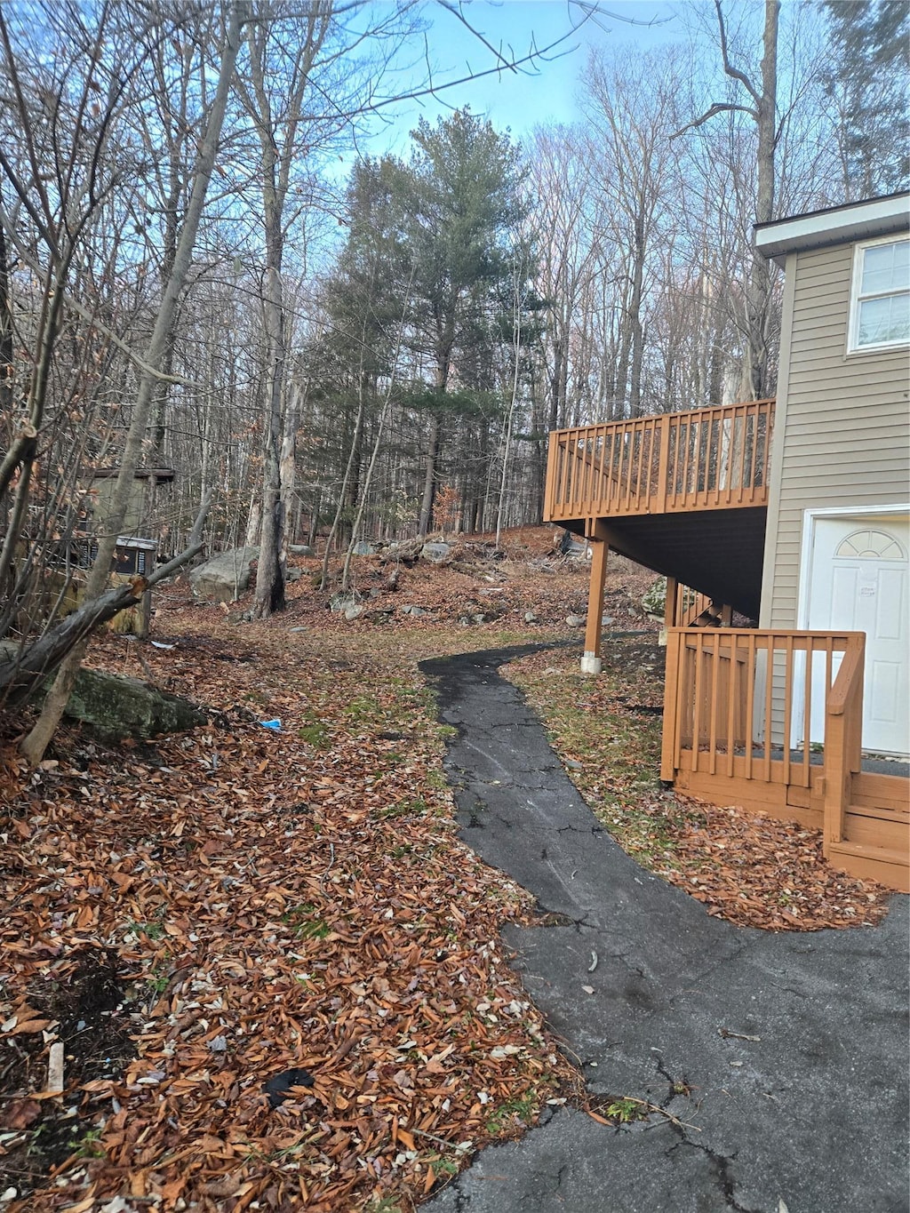 view of yard featuring a wooden deck