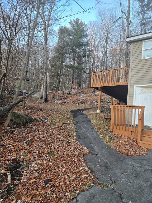 view of yard featuring a wooden deck