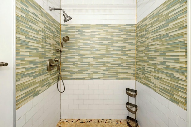 bathroom with tiled shower