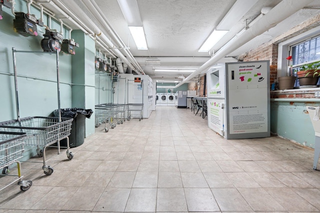 interior space with separate washer and dryer and light tile patterned floors